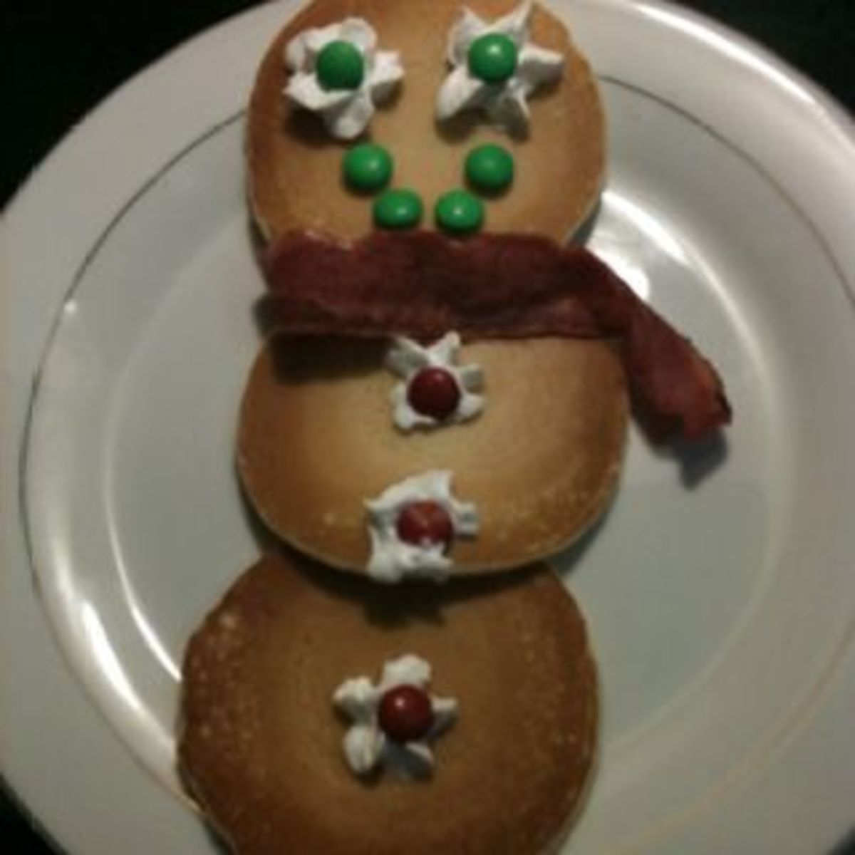 Snowman pancakes with bacon scarf