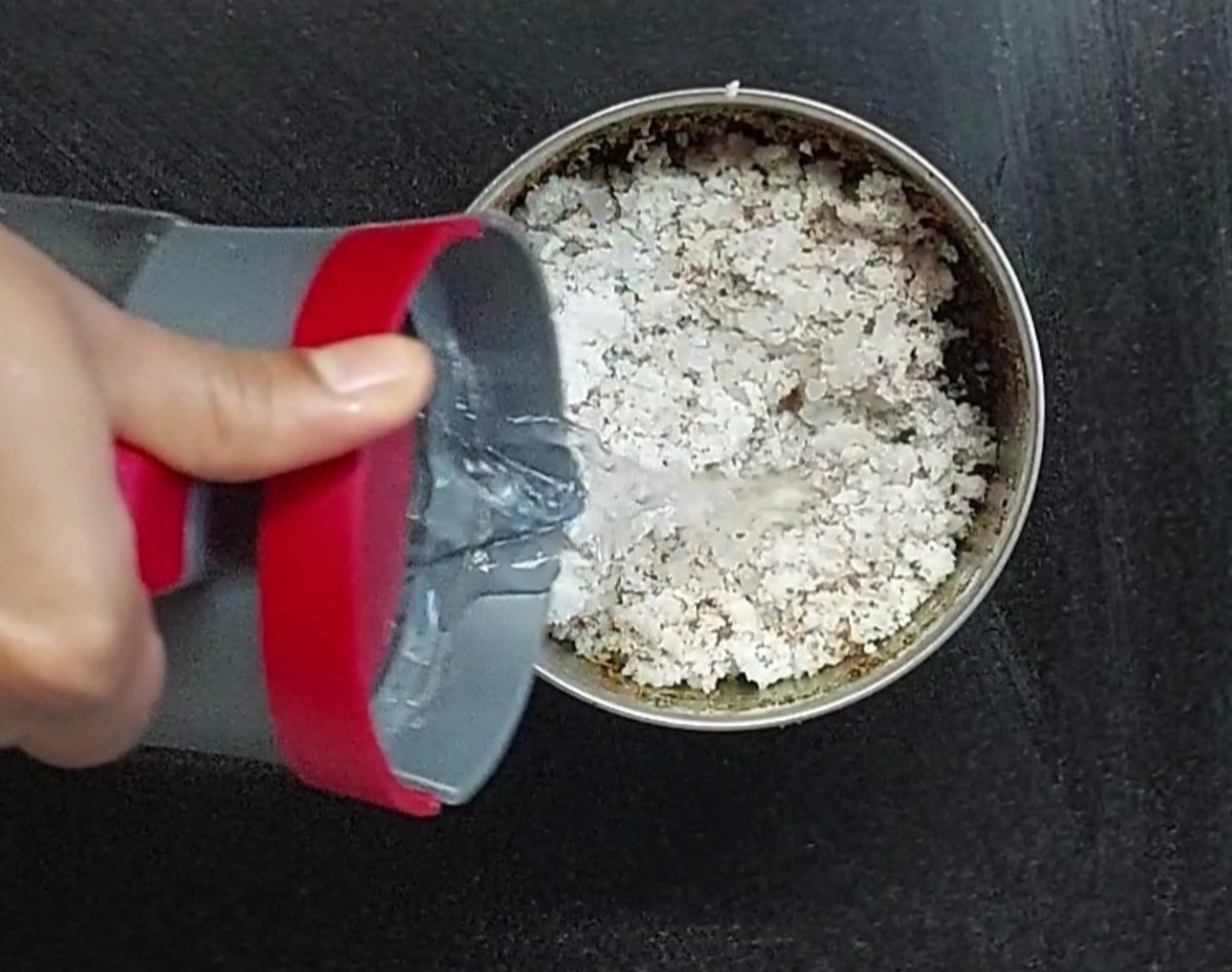 Open the lid. Add 1 cup fresh grated coconut, salt to taste and 1/2 cup water.