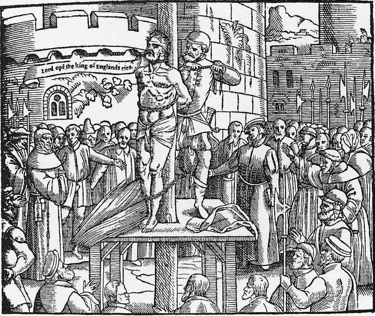 William Tyndale is strangled by his executioner prior to being burned at the stake.