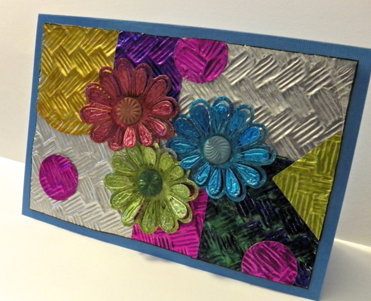 Use leftover foil lids to create these amazing-colored flowers added to an embossed aluminum foil background