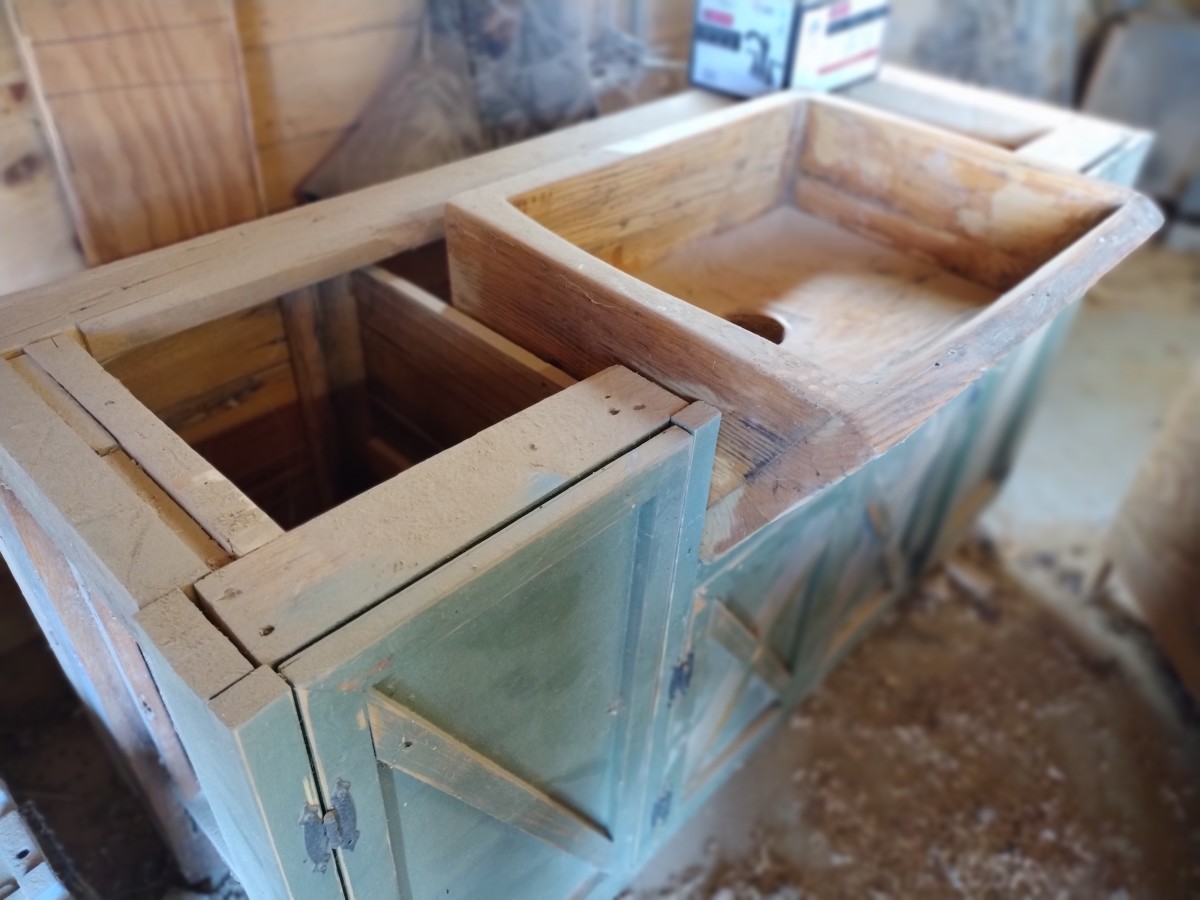 An example of a handcrafted sink and cabinet made completely from reclaimed timbers.