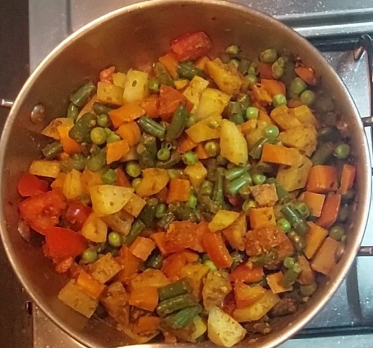 Mix well to combine vegetables with spices powders.