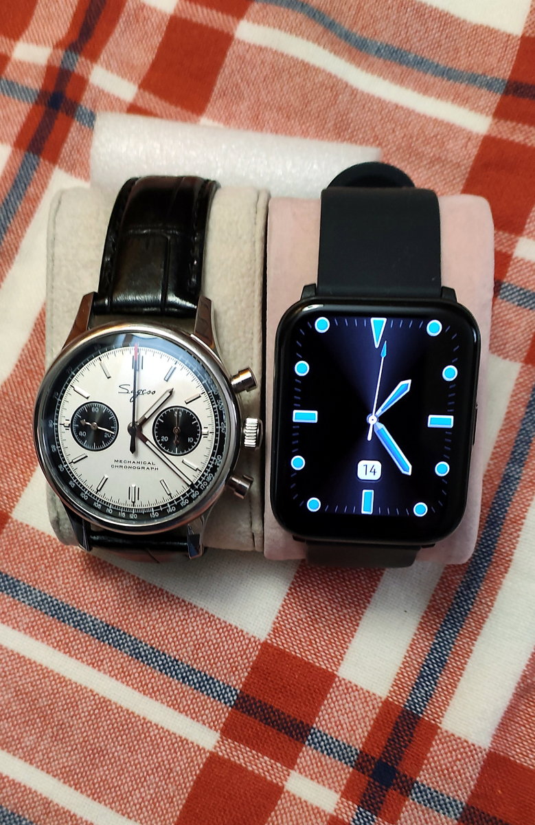 The Heyplus watch alongside my favorite mechanical timepiece