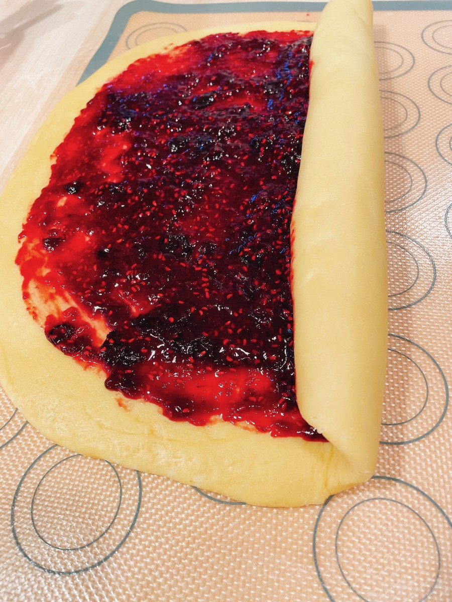 Starting at the long edge, tightly roll up each dough square jelly-roll style into a tight log.