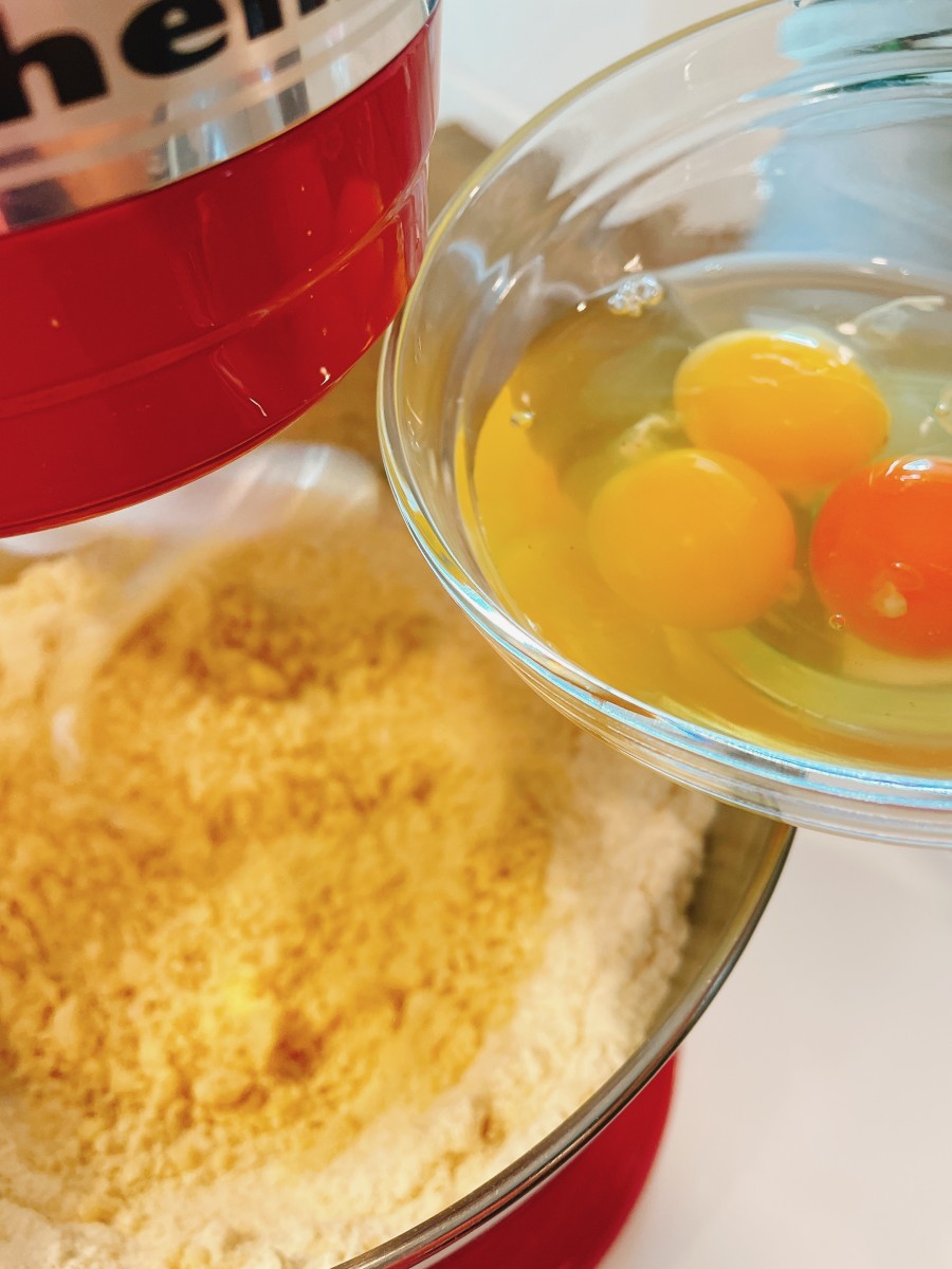Slowly add the eggs and vanilla extract into the wet mixture and continue mixing until it is all combined.