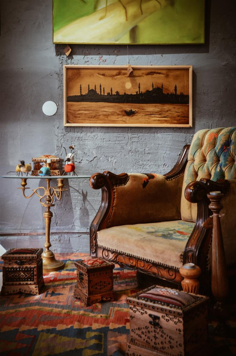 Antiques add a touch of whimsy. They help break up the monotony of a room that only has modern furniture in it.