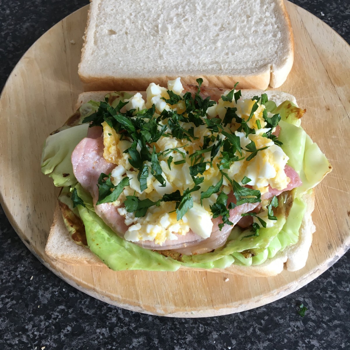 Fried bacon and cabbage leaves with boiled duck egg sandwich