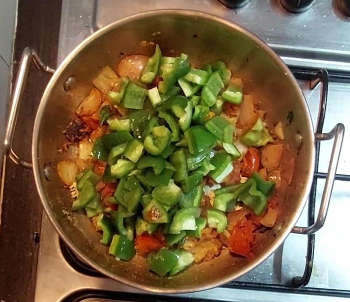Add 2 medium sized chopped capsicum.