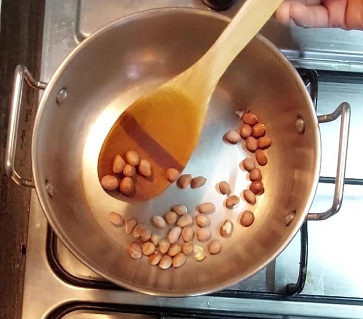 In a pan, dry-roast 2 tablespoons of peanuts till aromatic and the peels start to separate. Once done, transfer to a plate.