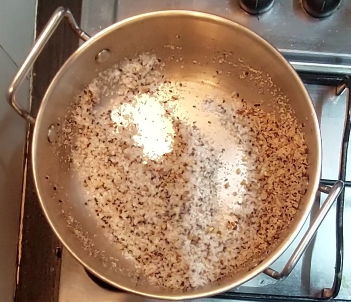 Fry till coconut turns brown and dry. Switch off the flame and transfer to a plate.