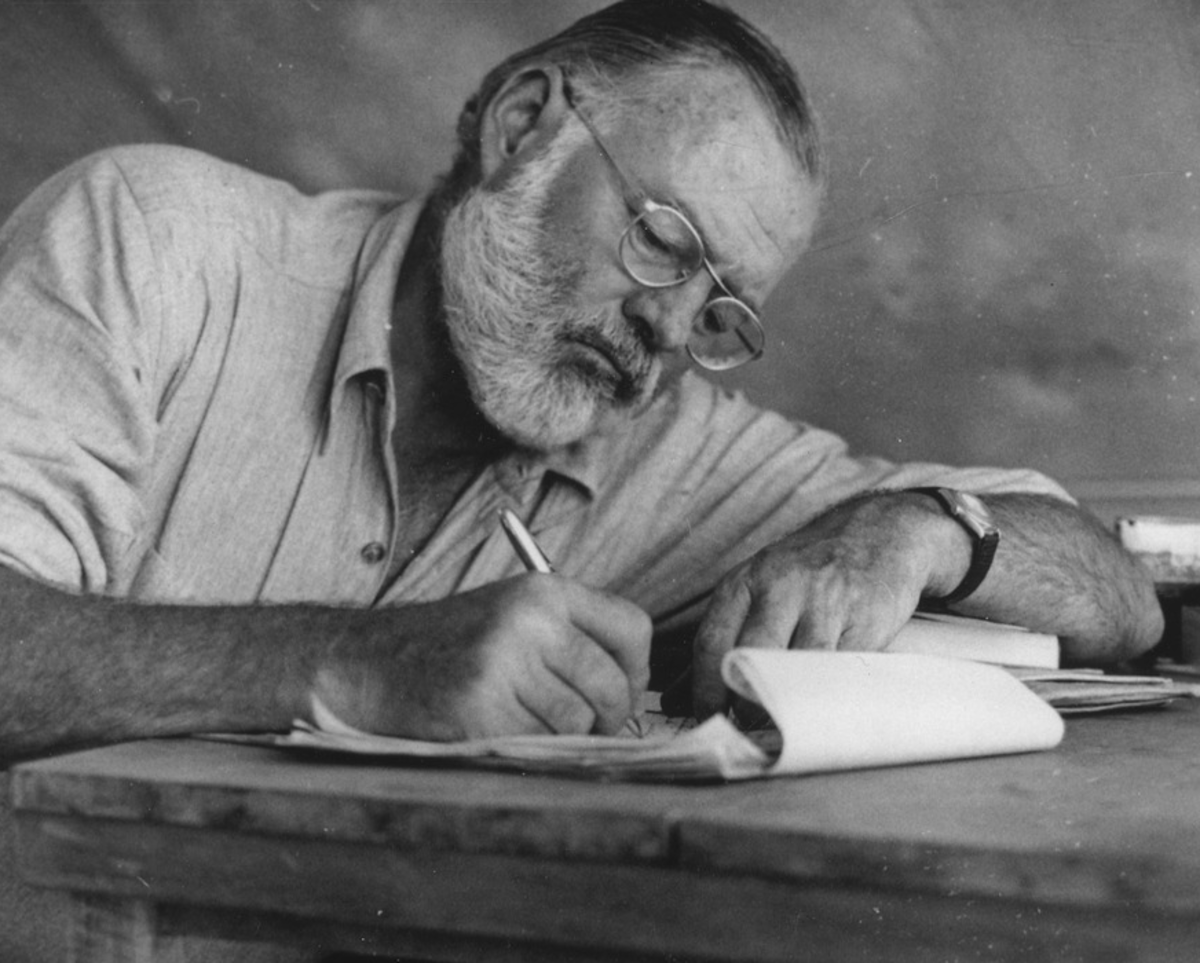 Ernest Hemingway writing in Kenya later in  life