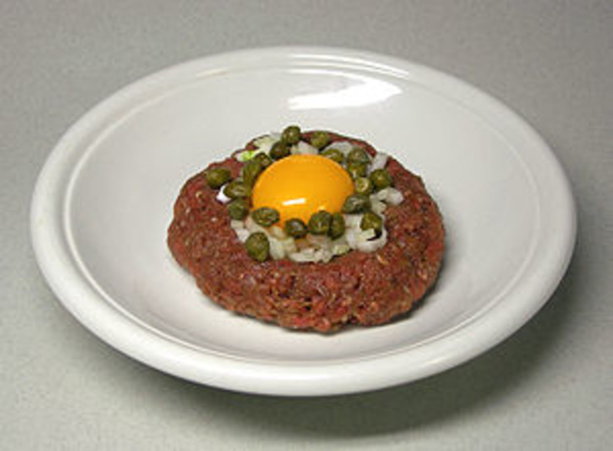 Beef Tartare: raw marinated meat with a raw egg on top