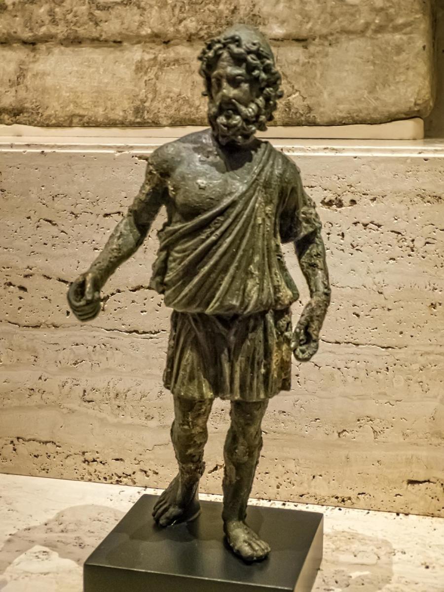 Statuette of Hephaestus the god of fire and patron of jewelers, armorers and blacksmiths Roman copy of a Greek original 1st - 2nd century CE Bronze Photographed by Mary Harrsch at the Nelson-Atkins Museum of Art, Kansas City, Missouri 