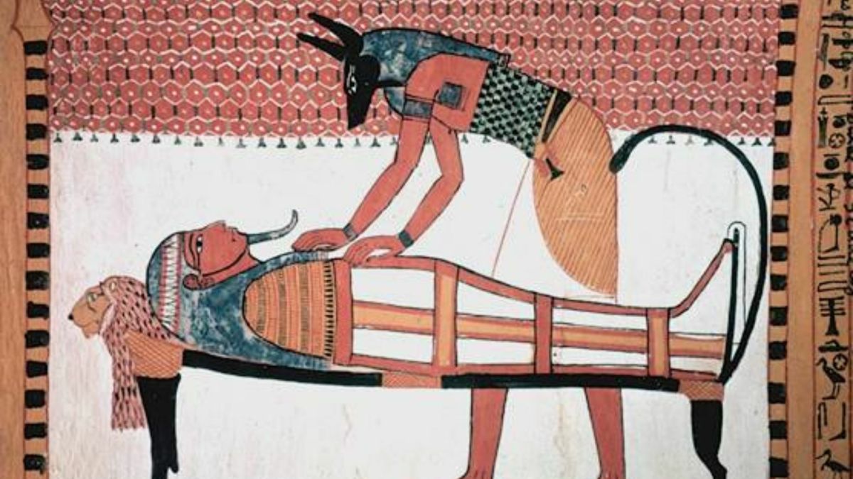Detail of a wall painting of Anubis attending to the mummy of Sennedjem