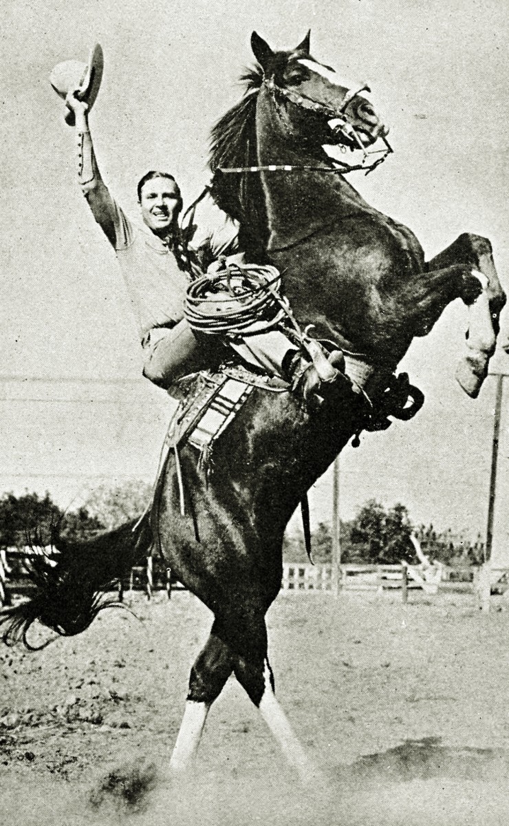 Gene Autry posing with Champion the Wonder Horse in 1939.