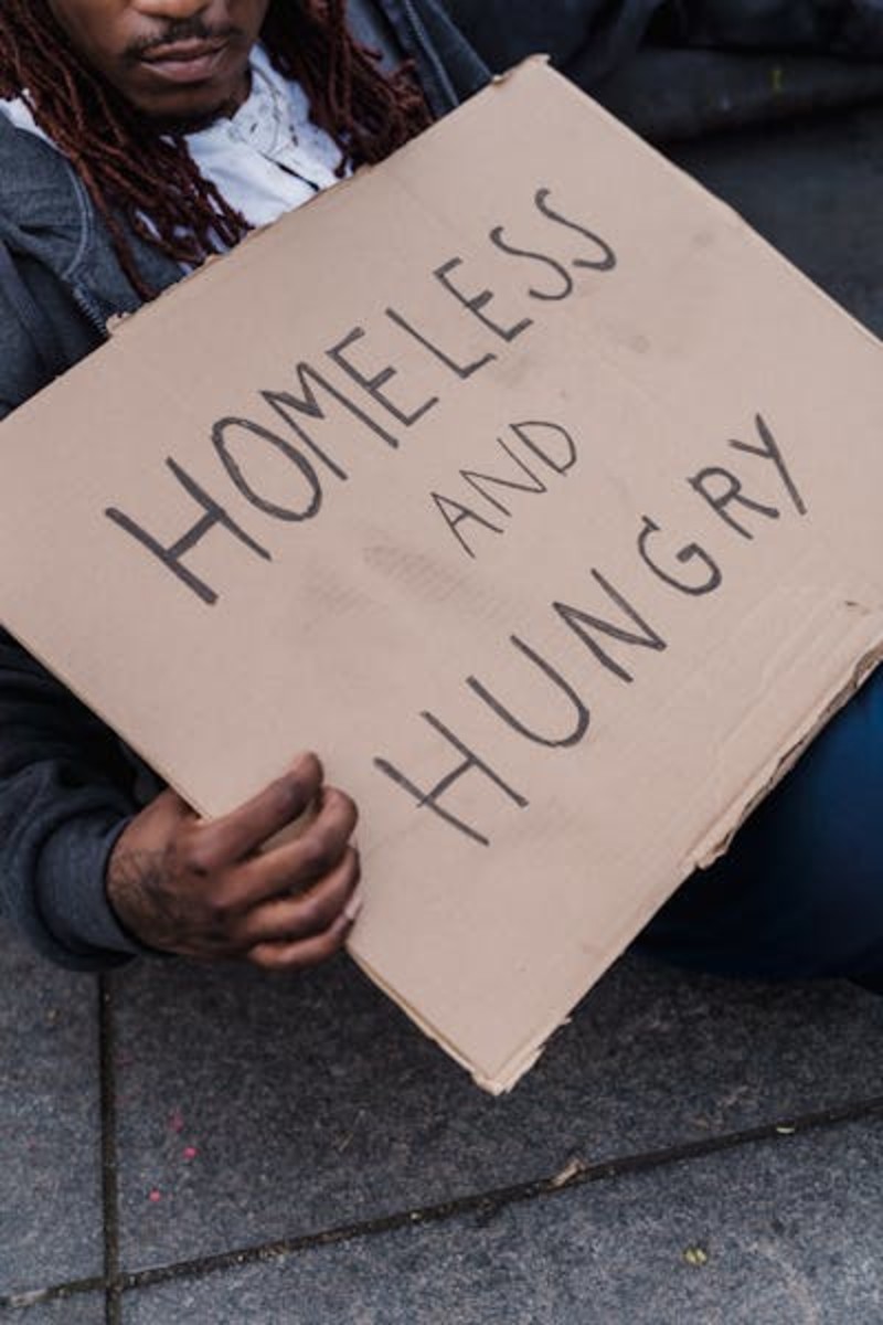 Homeless Winter Pitch a Cardboard Sleeping Bag a Draft Stone Door Way