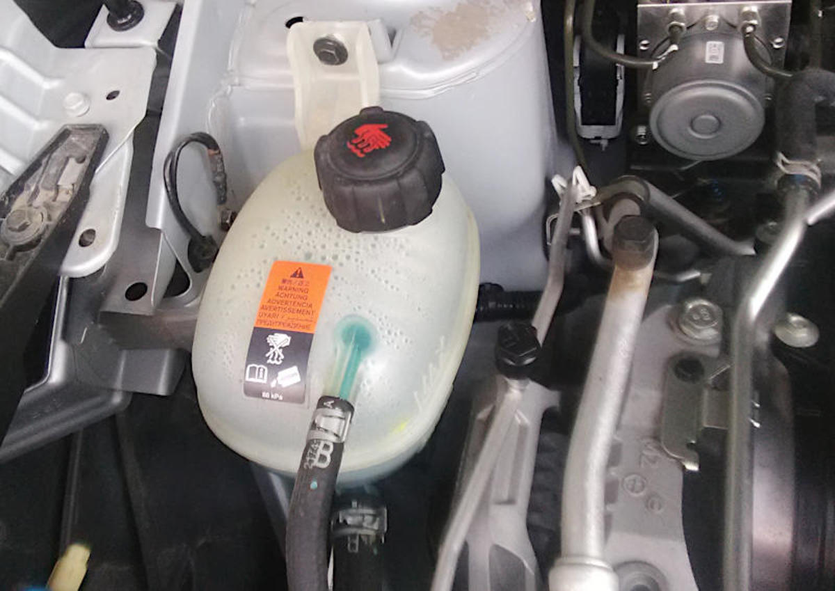 Why Is My Low Coolant Level Light On? AxleAddict