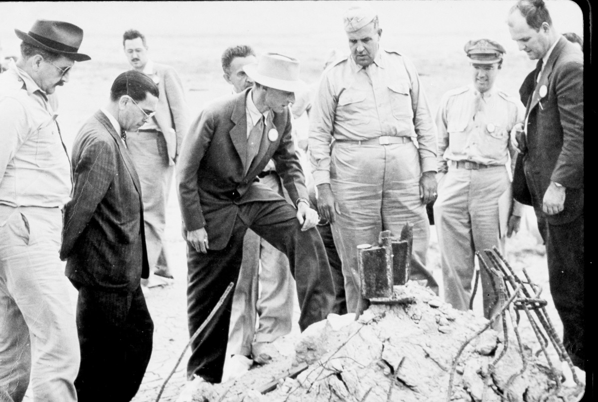 General Leslie Groves and J. Robert Oppenheimer at the Trinity detonation site in New Mexio, 1945.