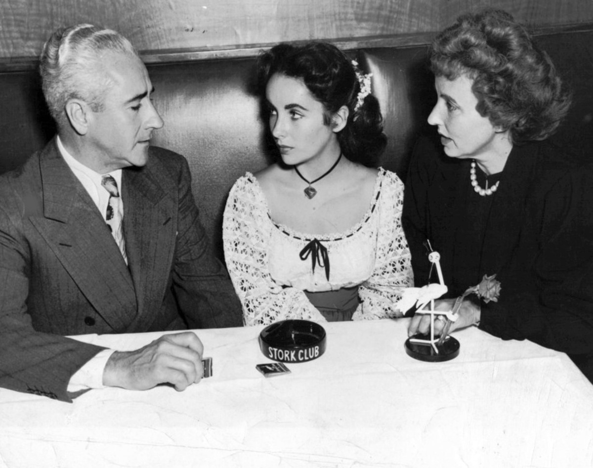 Elizabeth Taylor and her parents at the Stork Club in 1947