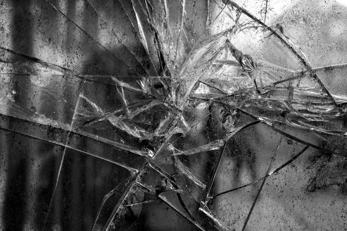 Reflections in Shattered Glass the Exploration of Distortion and Disconnection