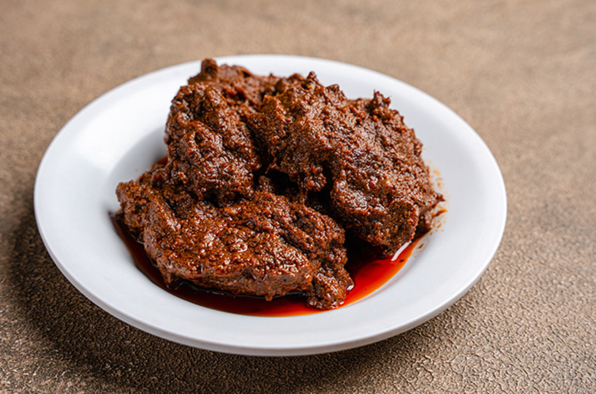 Must try foods in Indonesia for travelers - Rendang Cooking techniques and slow cooking process