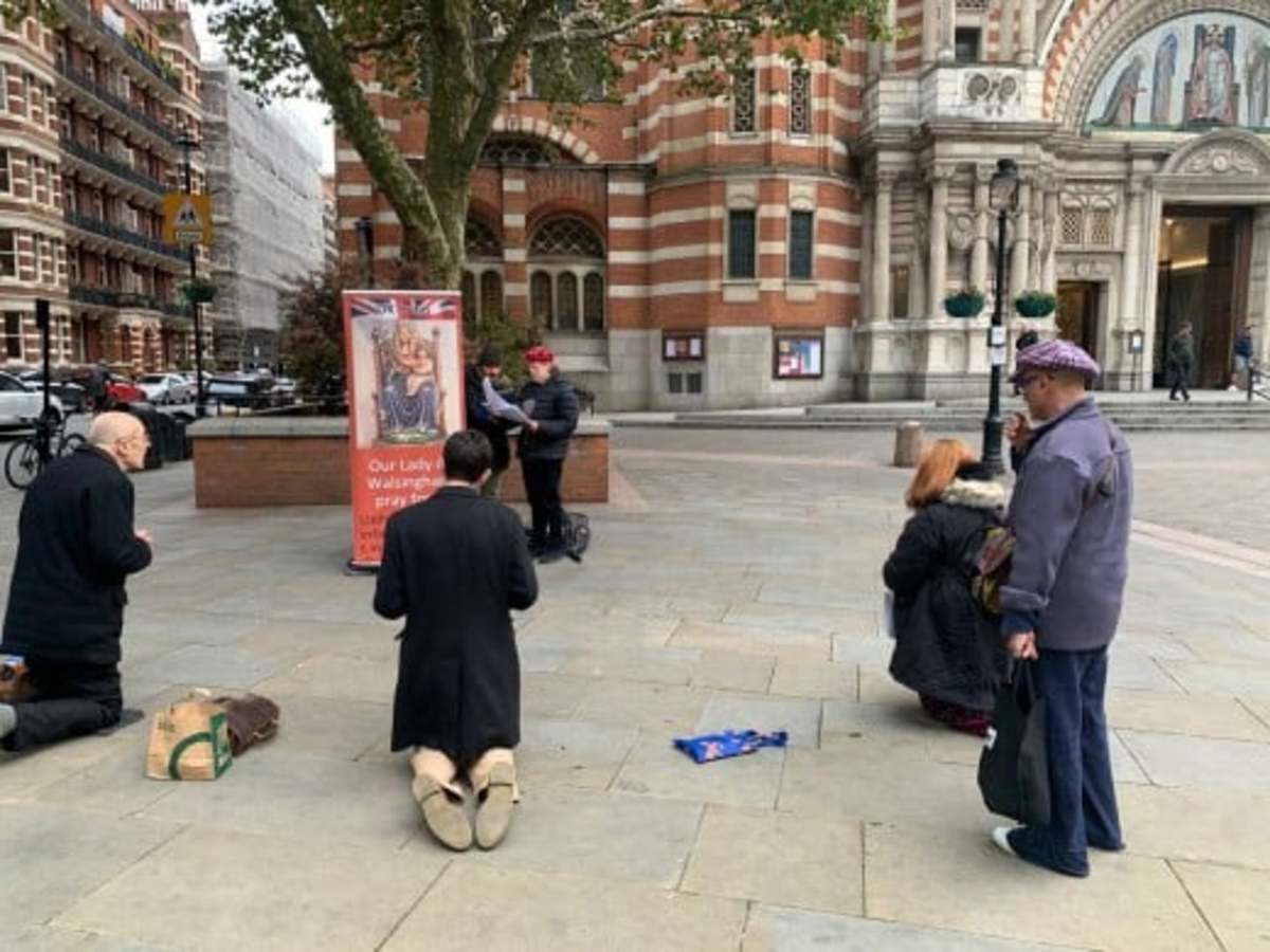 Catholics pray the rosary outside Westminster Cathedral, seeking peace and reflection