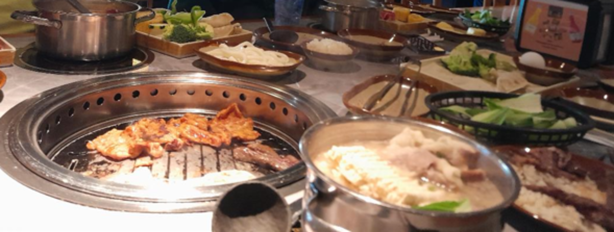 Diners Cook Their Own Meals at Their Table at Hot Pot Restaurants