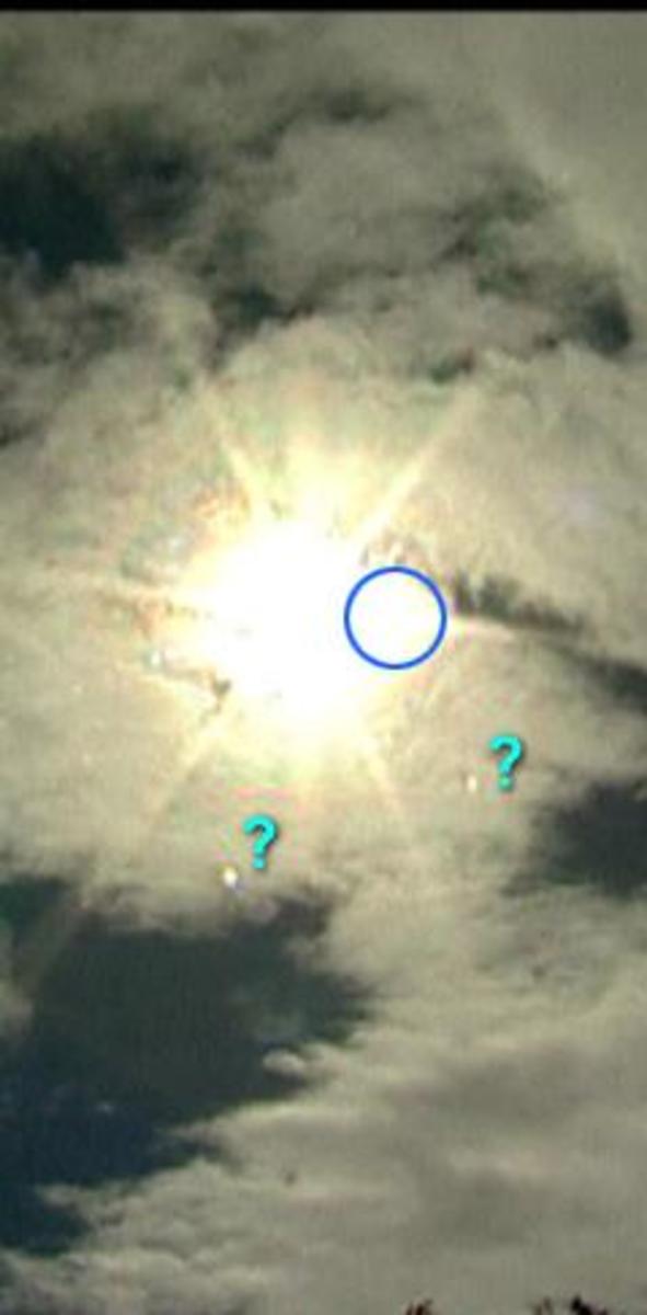 Nibiru Planet X photographed near the Sun with two of its Moon's showing as question marks. Nibiru Planet X photographed near the Sun with two of its Moon's showing as question marks.